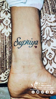 a person with a small tattoo on their foot that says supra in cursive writing