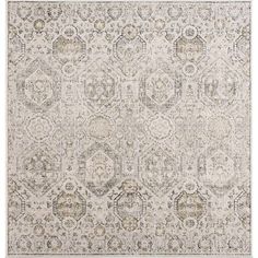 an area rug with many different colors and patterns on the carpet, including beiges and browns