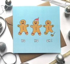 a card with three gingers on it and the words ho hoo written below