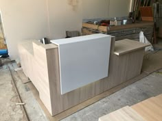 an unfinished reception desk in the process of being built