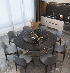 a marble dining table surrounded by grey chairs