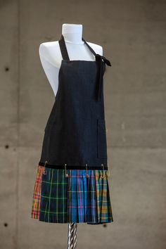 The Djufka apron is a handmade designer's item. It consists of high-quality materials with unique decorative details. The apron is one sized, but it can easily be adjusted to a perfect fit with the velvet ribbon around the neck. It is made of linen and tartan plaid taffeta. Velvet Ribbon, Tartan Plaid, Linen Apron, Learn To Sew, Dining Linens, Tartan, Apron, Perfect Fit, Plaid