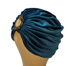 Petrol Velvet Turban / Turban with Sparkly Pin / Head Wrap / Pre Tied Headwrap / Chemo Turban Item ready to ship and to wear Handmade with a lot of love. This turban is chic and fun at the same time. Suitable for the young and cheeky girl who loves a fun and beautiful accessory and also for the mature woman who loves to give herself a touch of class and make herself unique. The smooth and soft velvet of this turban hat makes it pleasant to wear and comfortable for your winter months. Inside it is lined in light jersey so it can also be worn by those with alopecia problems. The bright brooch that I applied on the head makes it a luxury and elegant hat, you can remove the pin with ease if you want a simple headdress, to wear all day. A truly classy accessory that cannot be missing in your wa Simple Headdress, Chemo Turbans, Velvet Turban, Pin Head, Cheeky Girls, Elegant Hats, Turban Hat, Head Wrap, Winter Months