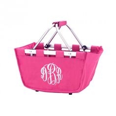 a pink shopping basket with two monogrammed initials