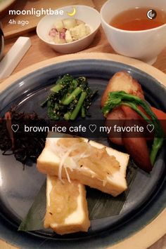 there is a plate with food on it and the words brown rice cafe my favorite