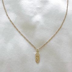 Delicate snake charm necklace with cubic zirconia details. The perfect necklace to wear alone or layer with other necklaces. 14k Gold Filled Chain length: 20” Lobster clasp closure Hypoallergenic Water resistant & tarnish free Nickel & lead free Gold Charm Necklace With Delicate Snake Chain, Elegant Charm Necklace With Snake Chain, Minimalist Yellow Gold Snake Chain Charm Necklace, Dainty Yellow Gold Snake Chain Charm Necklace, Elegant Gold Snake Chain Charm Necklace, Cute Necklace, Sustainable Jewelry, Cross Pendant Necklace, Gold Jewelry Fashion