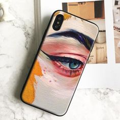 a phone case with an eye painted on it