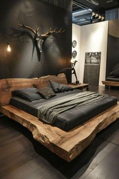 a bed made out of wood with antlers on the wall