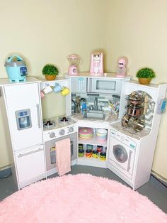 a play kitchen with lots of toys in it