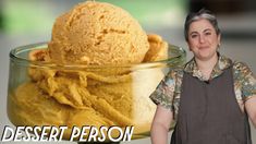 a woman standing next to a glass bowl filled with ice cream