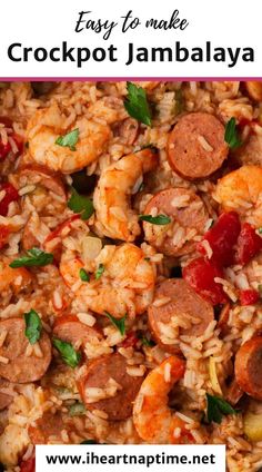 a close up of a plate of food with shrimp, sausage and rice on it