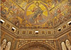 an ornate painting on the ceiling of a building