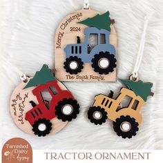 tractor ornament with christmas tree on top and name hanging from it's back