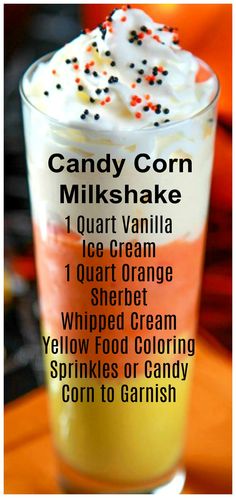 a candy corn milkshake with whipped cream and sprinkles on top