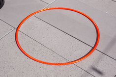 an orange circular object laying on the ground