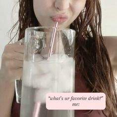 a woman drinking from a tall glass with a straw in her mouth and the caption what's ur - favorite drink? me