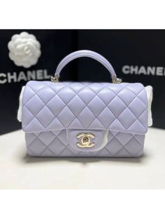 Gender: Women   Brand: CHANEL   Product Name: Classic Lambskin Gold Top Handle Mini Flap Bag Light Purple   Bags Alora Code: 13901947   Color: purple   Composition: Lambskin Leather   Origin: France   Features:  Chain Strap Leather Strap Lock closure    Designer Style ID AS2431 B06660 NF289 Mochila Chanel, My Style Bags, Luxury Bags Collection, Aesthetic Bags, Girly Bags, Chanel Purse, Luxury Purses, Fancy Bags, Pretty Bags