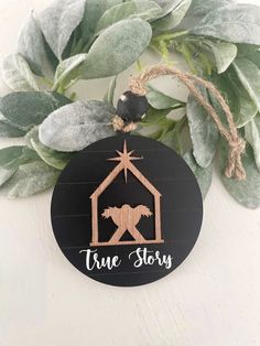 a christmas ornament with a nativity scene and the words true story on it