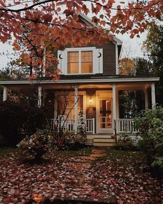 a house that is surrounded by leaves and trees