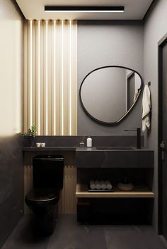 a bathroom with a toilet, sink and mirror