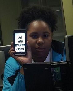 a woman holding up a cell phone with the words do you wannan't on it