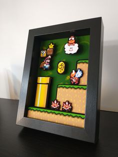 an image of a nintendo game being displayed in a shadow box