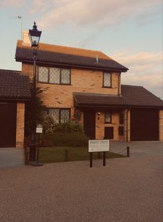 a house with a sign in front of it