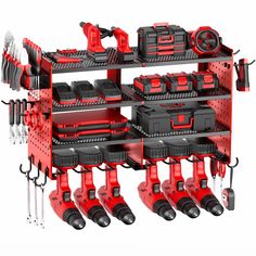 a red and black tool rack filled with tools