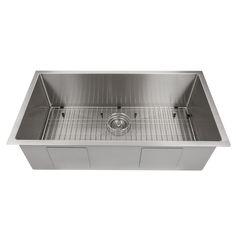 stainless steel kitchen sink with grids on the bottom