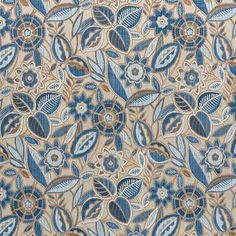 a blue and beige floral pattern on fabric