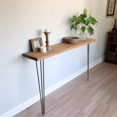 a wooden table with some plants on it