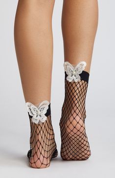 Embroidered butterflies put a whimsical spin on sassy fishnet socks edged by a wide band for a secure, comfortable fit. 85% nylon, 15% spandex Hand wash, line dry Imported Party Fishnet Socks, Trendy Mesh Stockings For Spring, Summer Fishnet Mesh Hosiery, Summer Fishnet Hosiery, Stretch Mesh Fishnet Socks, Stretch Fishnet Mesh Socks, Stretch Fishnet Socks Made Of Mesh, Stretchable Fishnet Mesh Socks, Fishnet Stockings For Summer