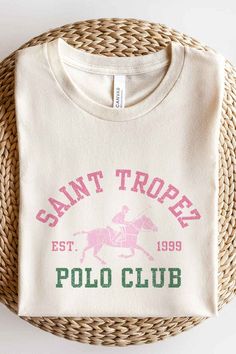 SAINT TROPEZ POLO CLUB GRAPHIC TEE / T-SHIRTPREMIUM COTTONUNISEX SIZINGCLASSIC FITBEST OF THE BEST Varsity Graphics, Catholic Tshirts, Polo Club, Resort Collection, Puff Sleeve Blouse, Flutter Sleeve Top, Saint Tropez, Workout Accessories, Wide Leg Jumpsuit