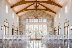 the inside of a church with rows of chairs set up in front of large windows