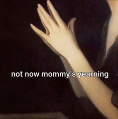 a woman holding her hands up with the words not now mommy's yearing