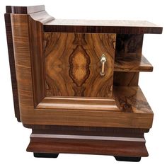 a wooden cabinet with an open door on the front and bottom shelf is made out of wood