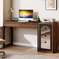 a wooden desk with a computer on it