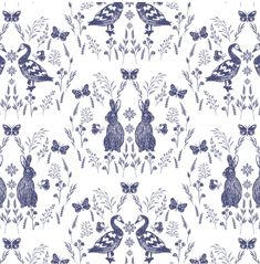 a blue and white floral pattern with rabbits