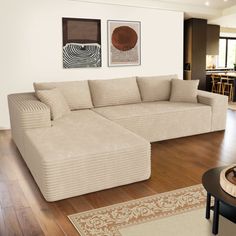 a living room filled with furniture on top of a hard wood floor