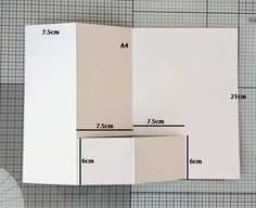 an open book is shown with measurements for the cover and side panels, along with a white umbrella