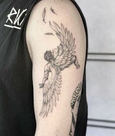 a man with a tattoo on his arm