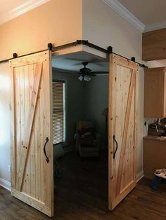 an open sliding door in the middle of a living room