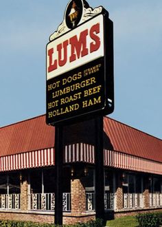 the front of a restaurant with a sign that says lums