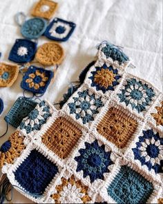 there are crocheted squares on the table