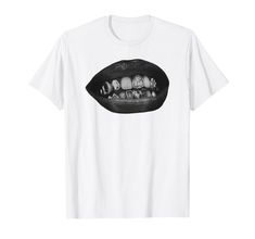 PRICES MAY VARY. Showcase your bold fashion sense with this "Grillz Teeth" design, perfect for those who love making a statement. Featuring stylish mouth and lips graphics, this design highlights the timeless and trendy appeal of grills, still very much in style today. Embrace the edgy look with this "Grillz Teeth" design. Ideal for fashion enthusiasts, this design captures the fashionable essence of grills, with detailed mouth and lips graphics that make a distinctive statement about your uniqu Mouth Shirt, Silver Bottom Grillz, Silver Fangs Grillz, Open Face Heart Grillz, Mouth Grills, Gold Outline Tooth Grill, Lips Tshirt, Grillz Teeth, Edgy Look