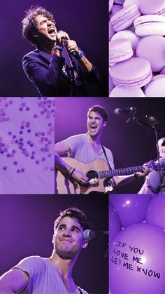 a man singing into a microphone while holding a guitar in front of purple balloons and stars