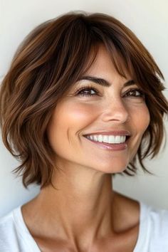 Save this pin for the best short layered haircuts with bangs. Choppy layers are intentionally uneven, giving this short style a trendy look. It’s an ideal style for thick or wavy hair that can hold layers well. Bangs Choppy Layers, Short Layered Haircuts With Bangs, Bangs Choppy, Shaggy Layered Bobs, Layered Haircuts With Bangs, Grey Hair Transformation, Choppy Bangs