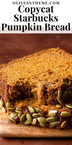 a loaf of pumpkin bread sitting on top of a wooden cutting board