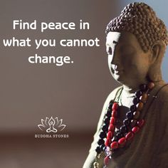 buddha statue with quote about finding peace in what you cannot't change on it