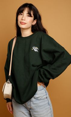 For good dogs and good humans. Our Saint Sweatshirt will become your go-to in your closet! Striking Forest Green color that goes with everything and made of medium-weight cotton blend for an extra cozy fit. Features our Saint Pup embroidered in white and gold! 50% cotton, 50% polyester Medium weight 1x1 ribbed collar, cuffs and waistband Double-needle stitching throughout Unisex Model wearing size L Saint Moritz, Good Dogs, Forest Green Color, Green Sweatshirt, Top Skirt Set, Green Hoodie, Be A Nice Human, Cozy Fits, Dog Shirt